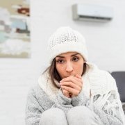 Woman warm in cold house