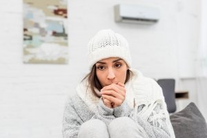 Woman warm in cold house